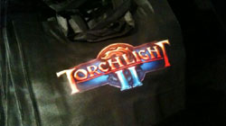 Torchlight 2 na targach GamesCom 2010 - taką torbę można tam było dostać.